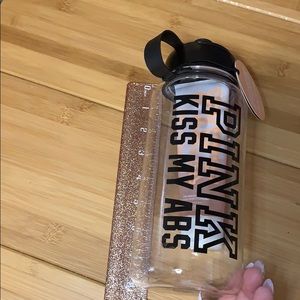 Victoria’s Secret pink water bottle and body scrub